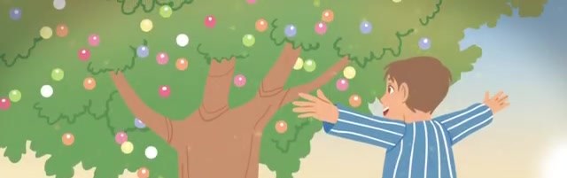 Troy in striped pajamas throws his arms wide at a tree covered in colorful gumballs.